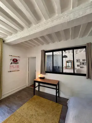 Un ou plusieurs lits dans un hébergement de l'établissement Cosy getaway in historic Bayeux