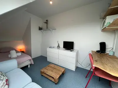 Télévision ou salle de divertissement dans l'établissement Studio Cosy avec Parking Privé