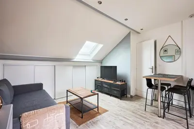 Coin salon dans l'établissement Au Jardin de Mel - Appt à moins d'1 km de la plage