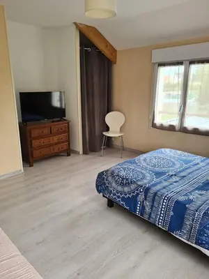 Un ou plusieurs lits dans un hébergement de l'établissement Grande maison conviviale à Flamanville avec jardin clos