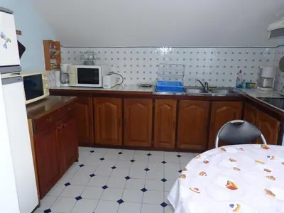 Cuisine ou kitchenette dans l'établissement APPARTEMENT AVEC TERRASSE ET BARBECUE