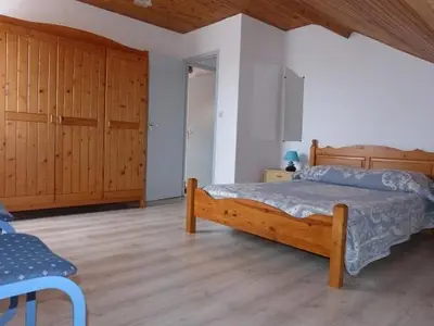 Un ou plusieurs lits dans un hébergement de l'établissement APPARTEMENT AVEC TERRASSE ET BARBECUE