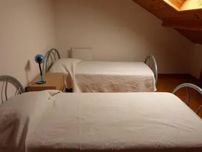 Un ou plusieurs lits dans un hébergement de l'établissement APPARTEMENT AVEC TERRASSE ET BARBECUE