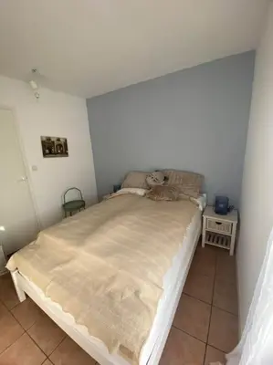 Un ou plusieurs lits dans un hébergement de l'établissement L'Océan, maison avec jardin clos