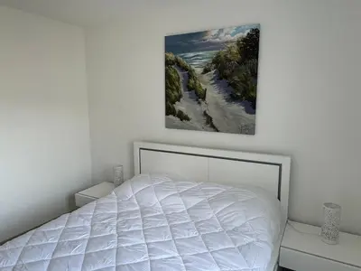 Un ou plusieurs lits dans un hébergement de l'établissement Charmant 2P avec balcon, proche plage et centre | Parking | Wifi | 4 pers | Cabourg - FR-1-487-365