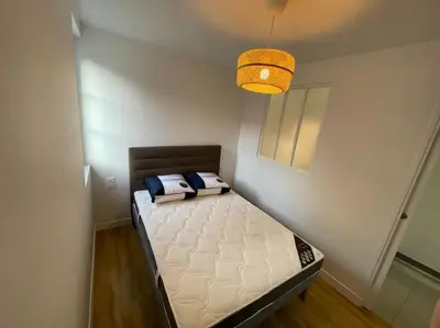Un ou plusieurs lits dans un hébergement de l'établissement Charmante Maisonnette - 5 min du Pôle Hippique de Saint-Lô