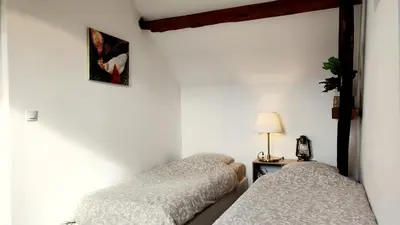 Un ou plusieurs lits dans un hébergement de l'établissement Studio équipé au sein d'une fermette