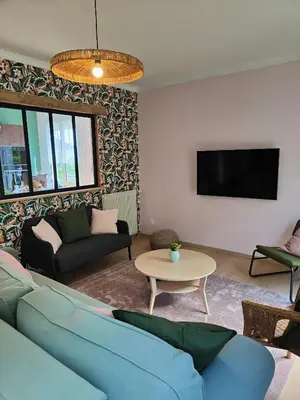 Télévision ou salle de divertissement dans l'établissement Le gîte de la tortue