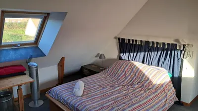 Un ou plusieurs lits dans un hébergement de l'établissement Studio proche de la mer à Luc Sur Mer