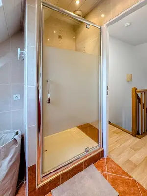 Un ou plusieurs lits dans un hébergement de l'établissement Charmante maison familiale