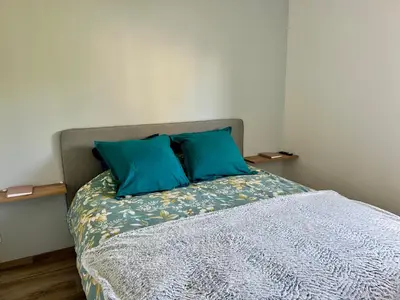 Un ou plusieurs lits dans un hébergement de l'établissement Maison au calme, à la campagne