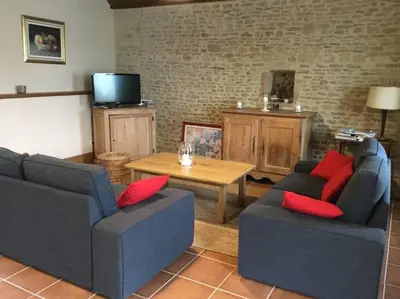 Coin salon dans l'établissement Gite Normand sur les plages du débarquement.