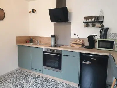 Cuisine ou kitchenette dans l'établissement Gîte proche de Sainte Mère Eglise