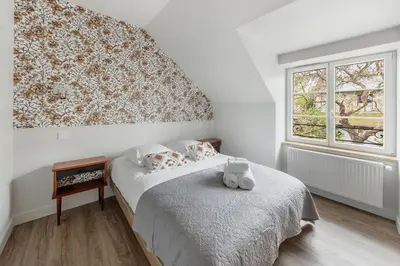 Un ou plusieurs lits dans un hébergement de l'établissement La Baie - Belle maison de charme -Jardin et Parking