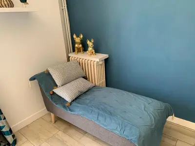 Un ou plusieurs lits dans un hébergement de l'établissement La Grande Terrasse, appartement rez-de-jardin