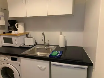 Cuisine ou kitchenette dans l'établissement La Grande Terrasse, appartement rez-de-jardin