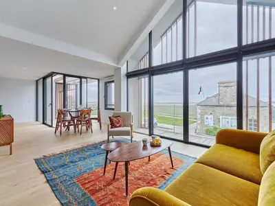 Coin salon dans l'établissement Holiday Home Le Sund by Interhome