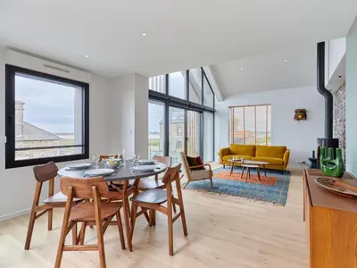 Coin salon dans l'établissement Holiday Home Le Sund by Interhome