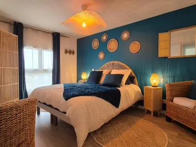 Un ou plusieurs lits dans un hébergement de l'établissement Villa Terre & Mer avec piscine intérieure proche Cabourg