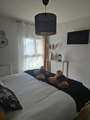 Un ou plusieurs lits dans un hébergement de l'établissement Villa Terre & Mer avec piscine intérieure proche Cabourg