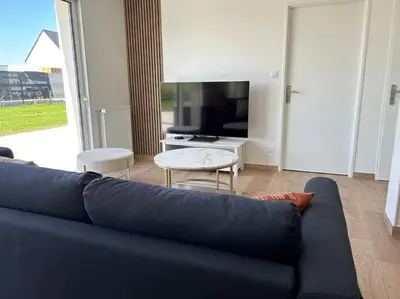 Télévision ou salle de divertissement dans l'établissement Gîte des couleurs