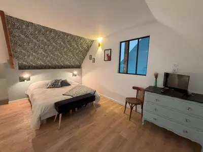 Un ou plusieurs lits dans un hébergement de l'établissement Duplex Parapluies de Cherbourg Netflix Parking