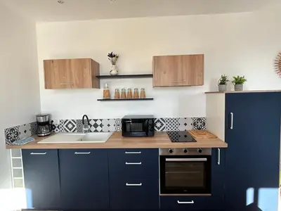 Cuisine ou kitchenette dans l'établissement Appartement Cote des Isles