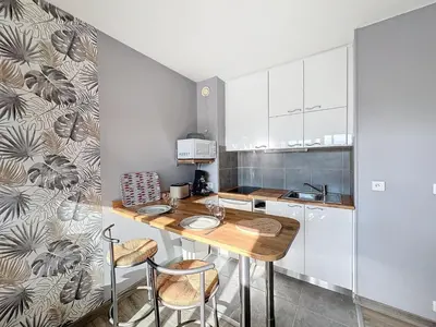 Cuisine ou kitchenette dans l'établissement JUNO Appart