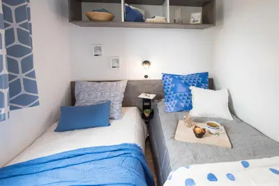 Un ou plusieurs lits dans un hébergement de l'établissement Bungalow Bord de mer
