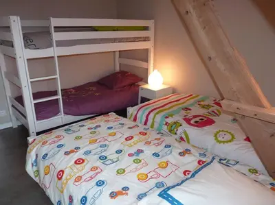 Un ou plusieurs lits dans un hébergement de l'établissement Le 107 grande maison accès direct et vue sur mer