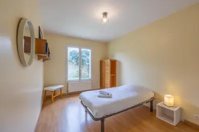 Un ou plusieurs lits dans un hébergement de l'établissement Le Nest quiet house in city center