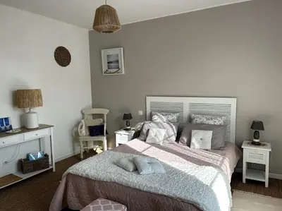 Un ou plusieurs lits dans un hébergement de l'établissement Appartement de la plage