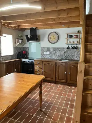 Cuisine ou kitchenette dans l'établissement Gîte des champs fondus