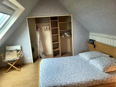 Un ou plusieurs lits dans un hébergement de l'établissement Villa front de mer les Cordylines
