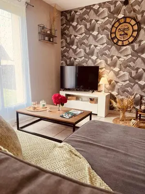 Télévision ou salle de divertissement dans l'établissement Maison vacance proche ste mère église