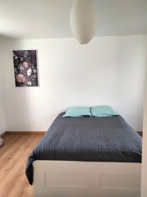 Un ou plusieurs lits dans un hébergement de l'établissement Maison avec jardin Cherbourg