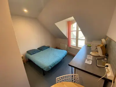 Un ou plusieurs lits dans un hébergement de l'établissement Appartement ou chambre centre cherbourg