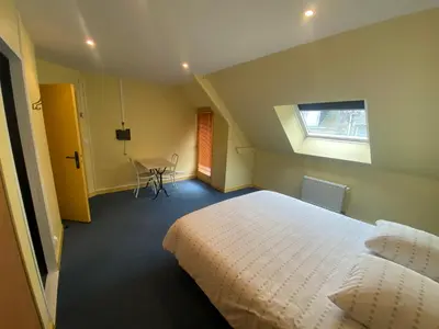 Un ou plusieurs lits dans un hébergement de l'établissement Appartement ou chambre centre cherbourg