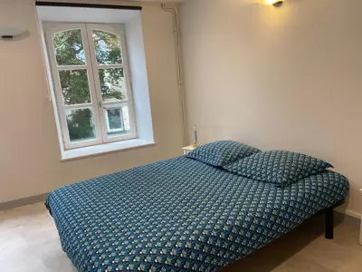 Un ou plusieurs lits dans un hébergement de l'établissement Appartement ou chambre centre cherbourg