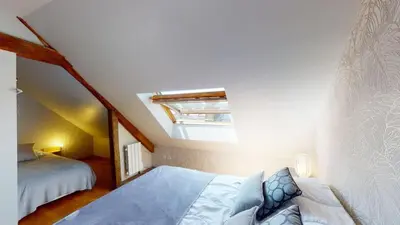 Un ou plusieurs lits dans un hébergement de l'établissement La Clef Decamp Villa et Cour Paradis 22 pers billard 20 min mer