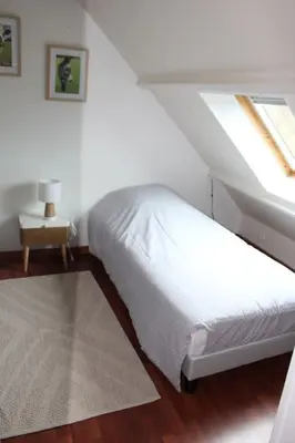 Un ou plusieurs lits dans un hébergement de l'établissement Maison jardin proximité Bayeux, Arromanches
