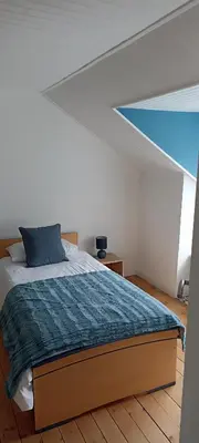 Un ou plusieurs lits dans un hébergement de l'établissement Chez titine gîte du Bon Accueil