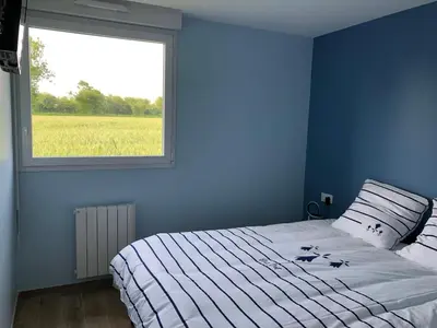 Un ou plusieurs lits dans un hébergement de l'établissement Appartement proximité Saint lo
