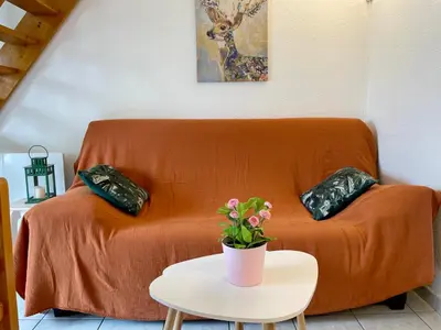 Coin salon dans l'établissement L'ALOUETTE maison 4/5pers PISCINE/MER Cabourg à pied