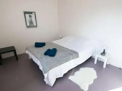Un ou plusieurs lits dans un hébergement de l'établissement Appartement terrasse