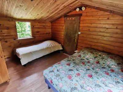 Un ou plusieurs lits dans un hébergement de l'établissement Chalet de la Prairie - Terrain privé - Bain Nordique