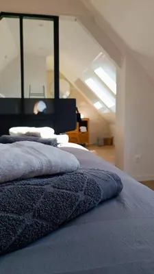 Un ou plusieurs lits dans un hébergement de l'établissement Mont Gîte Des Herbus Puccinellie avec Jacuzzi 2 personnes entre Granville et Mont Saint Michel