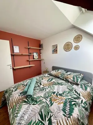 Un ou plusieurs lits dans un hébergement de l'établissement Grand appartement vue théâtre Hyper Centre