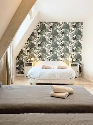 Un ou plusieurs lits dans un hébergement de l'établissement Maison Confortable Proche des Plages