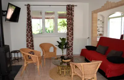 Coin salon dans l'établissement Le Caprice de la mer - maison avec véranda, jardin
